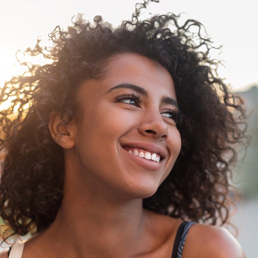 woman smiling with dental crowns in Garland
