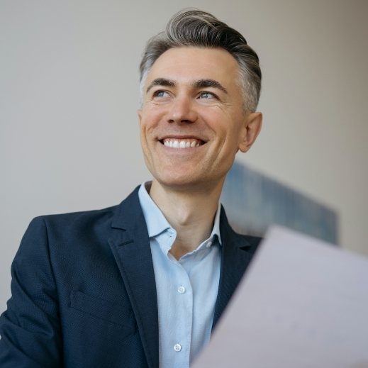 Man sharing healthy smile after dental implant tooth replacement