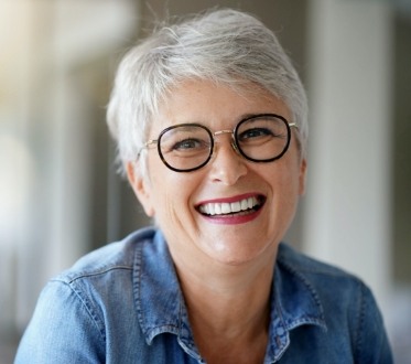 Woman sharing smile after full mouth restoration