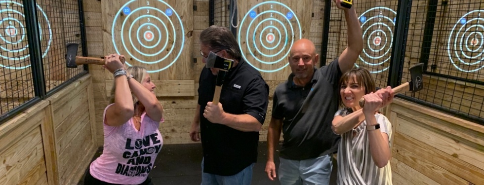 Doctor Mason and her family at a hatchet throwing venue